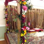 (Pillars of Floral Mandap)
The four gold pillars were dressed with long swags of fresh flowers. ~