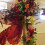 (Floral Mandap Corner Topper)
Towering the top of the two front pillars were floral arrangements that added height,  fullness and color. ~