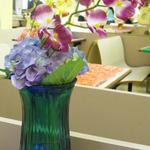 (Floral Centerpiece)
The orchids were exotic and interesting. Utilizing my rentals, they were definitely much less expensive than purchasing them at a local craft store. You couldn't even tell they were artificial orchids! ~