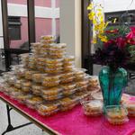 (Snack Table Design and Decor)
During intermission, the snack area was set up in the commons. The snack containers were tiered, a large vase with faux flowers added decor and the table covering added a punch of bold color. ~