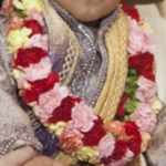 (Baby Garland)
A last minute creation needed by my client was a garland for the baby's ceremony. Using mini carnations, I constructed the garland, alternating colors of red, pink, orange and yellow. ~